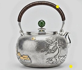 Fine silver teapot with traditional landscape relief £5450 order number 525