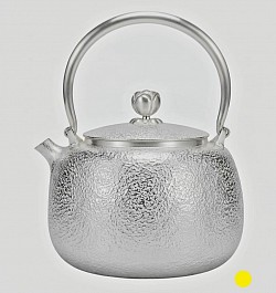 Fine hammered silver teapot with elegant finial and attractive curved handle £5000 order number 088