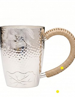 Sterling silver mug with woven rattan handle £1800 order number 880. This sterling silver mug with woven rattan handle features intricate motifs
