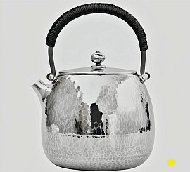 Hand-Hammered sterling silver teapot with black wrapped handle £5500 order number 880
