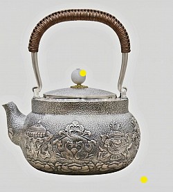 Sterling silver teapot with intricate relief & woven handle £5000 order number 555