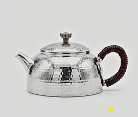 Sterling silver teapot with dark rattan wrapped handle £1400 order number 588